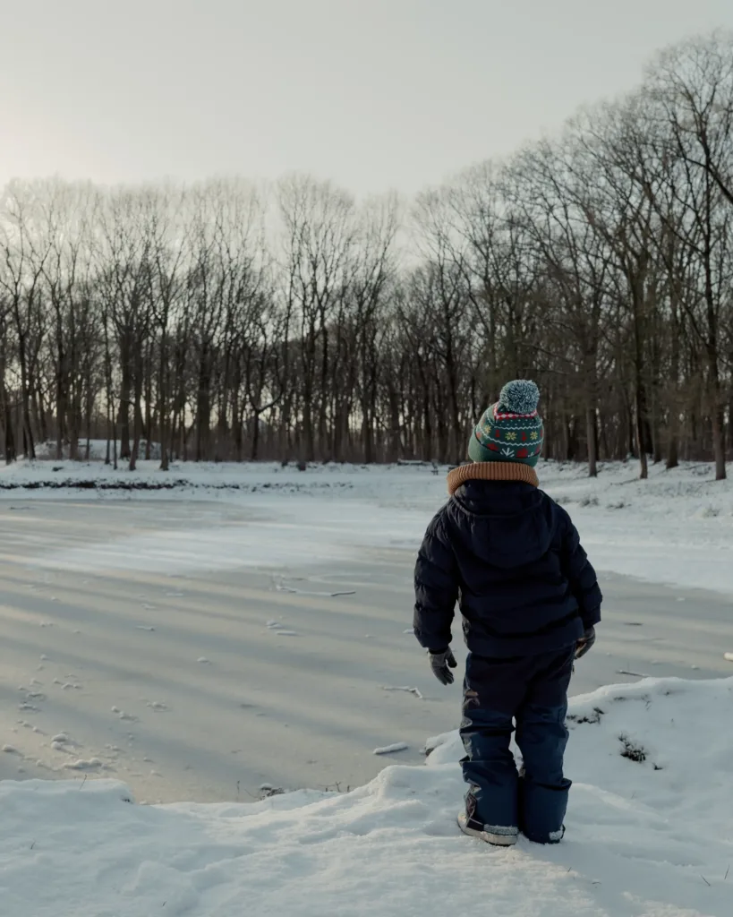 child winter walk ice lake