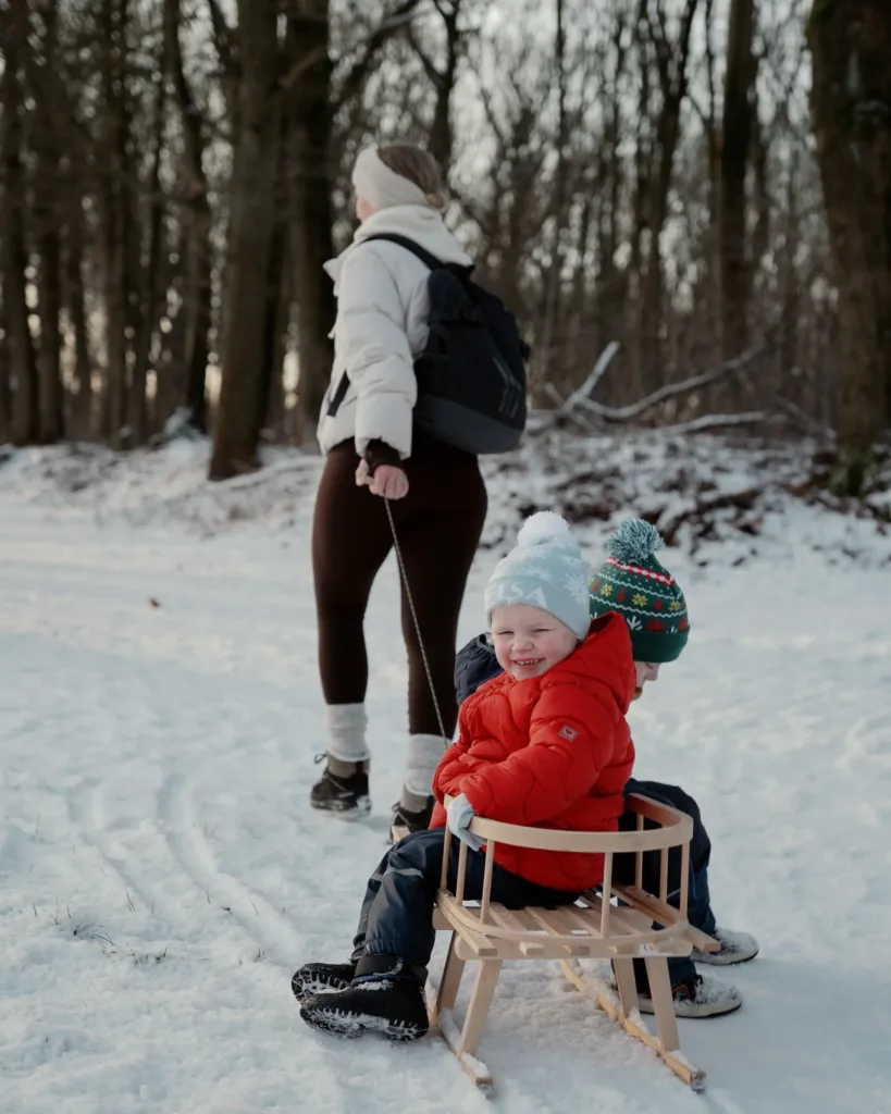 winter walk sleighing family
